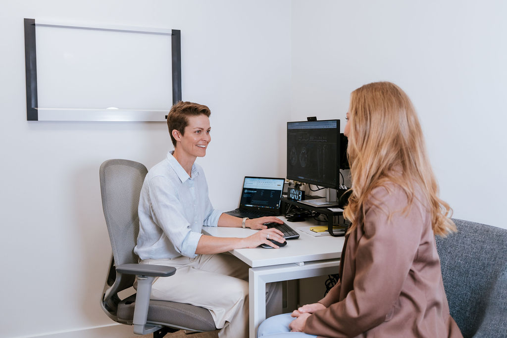 Dr Kimberley Wells reviewing imaging with a patient at the Maroochydore clinic