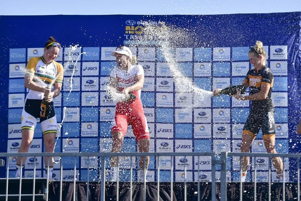 Dr Kimberley Wells celebrating victory at Noosa Festival of Cycling